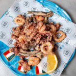 Sciué Premuda Comida